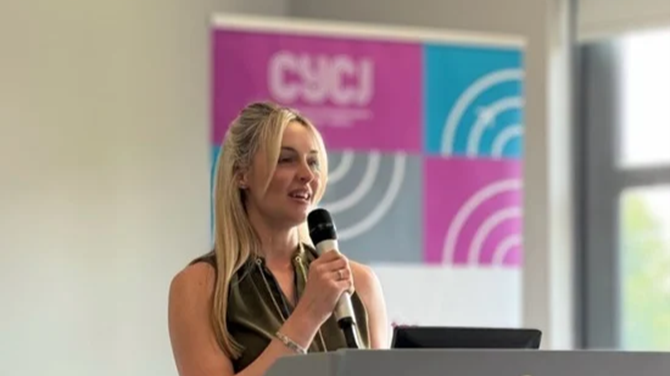 Director giving a speech in conference CYCJ